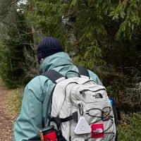Customer photo — the clip on a backpack strap while hiking